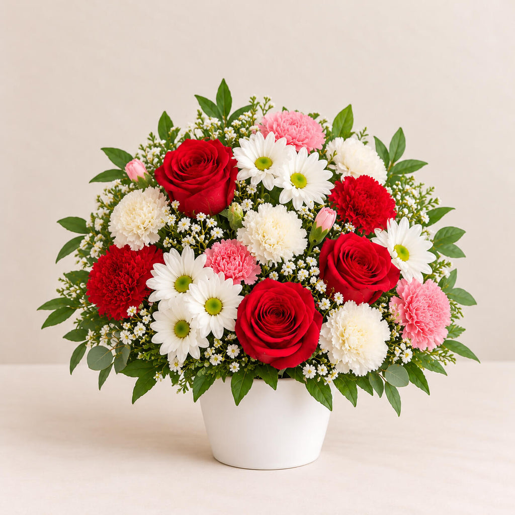 Centro de flores con rosas y claveles primavera