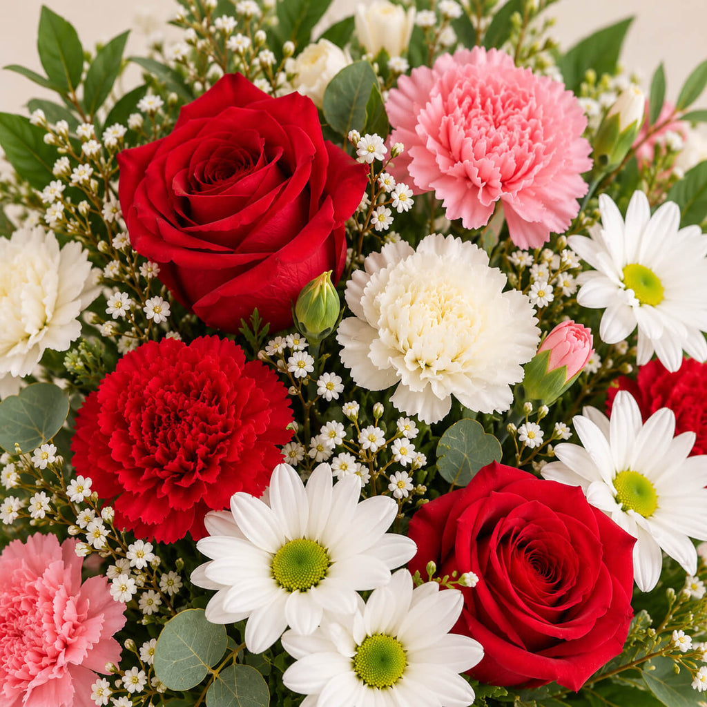 Centro de flores con rosas y claveles primavera